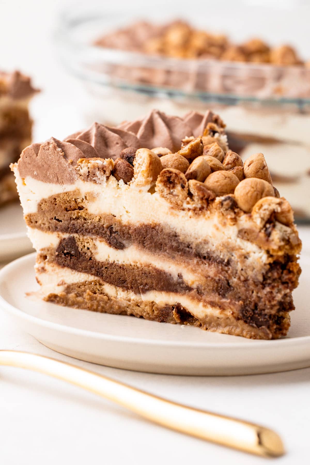 A close up slice view of the cookies and milk icebox cake.