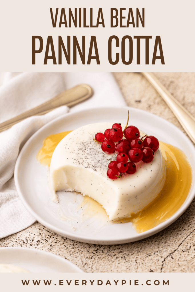 A panna cotta dessert on a plate with a fruit garnish.