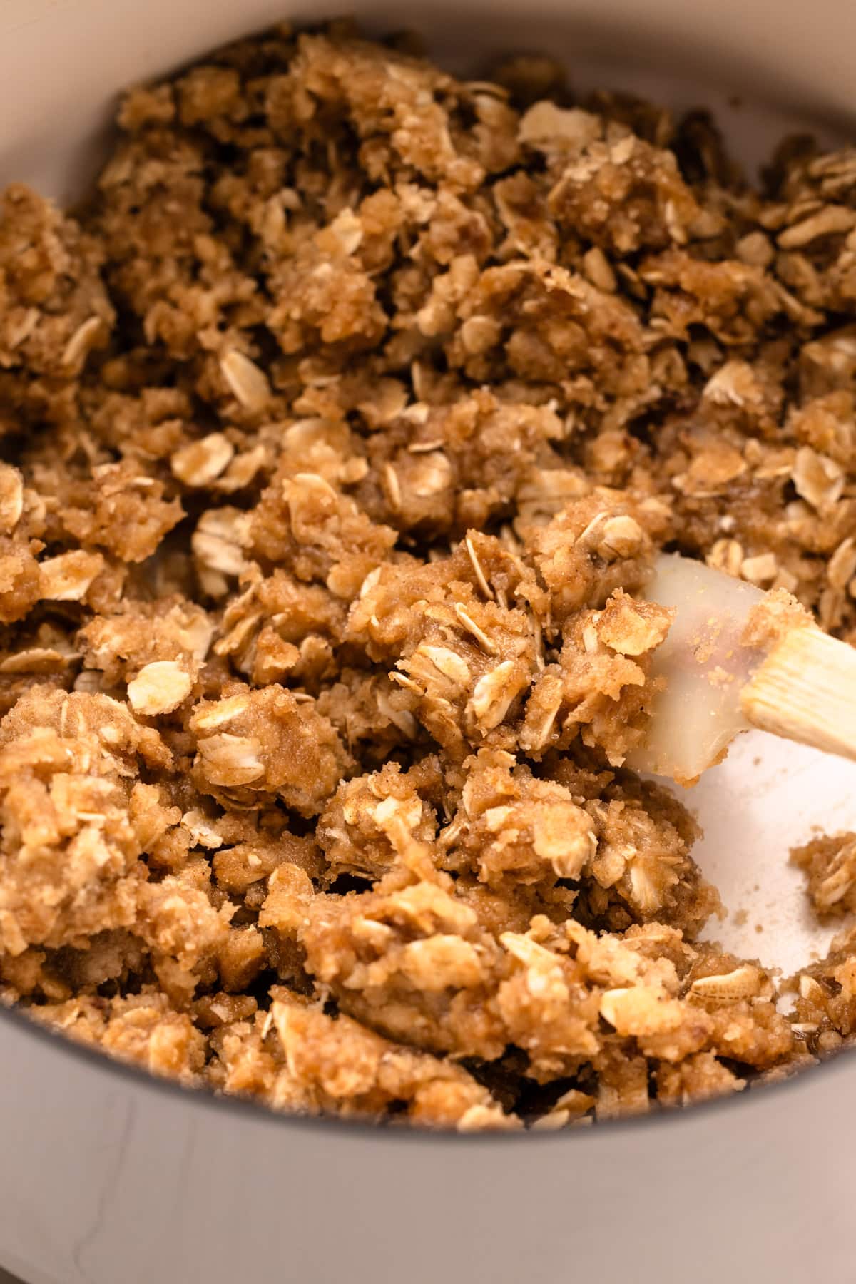 An oat streusel mixture before it is baked.