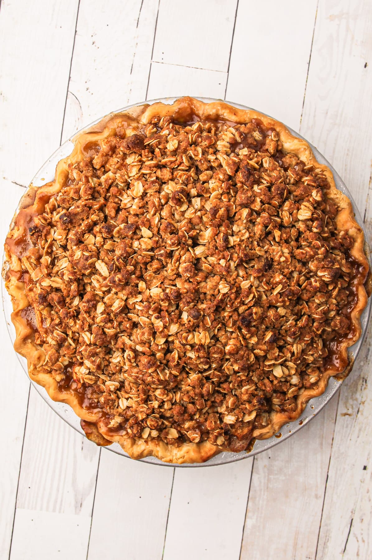 A baked apple crumb pie.