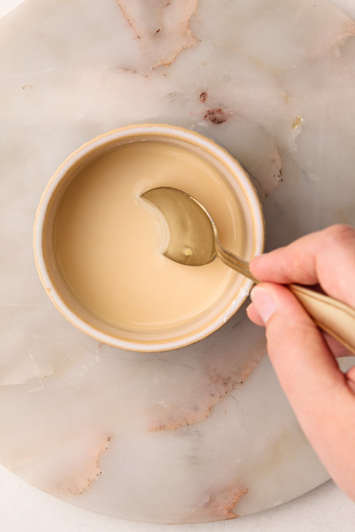 A cornstarch slurry in a small bowl.