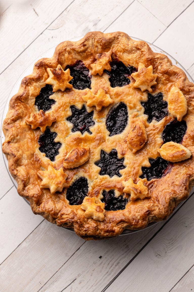 A baked Blueberry-Cranberry Pie with fall leaf cutouts in the crust.