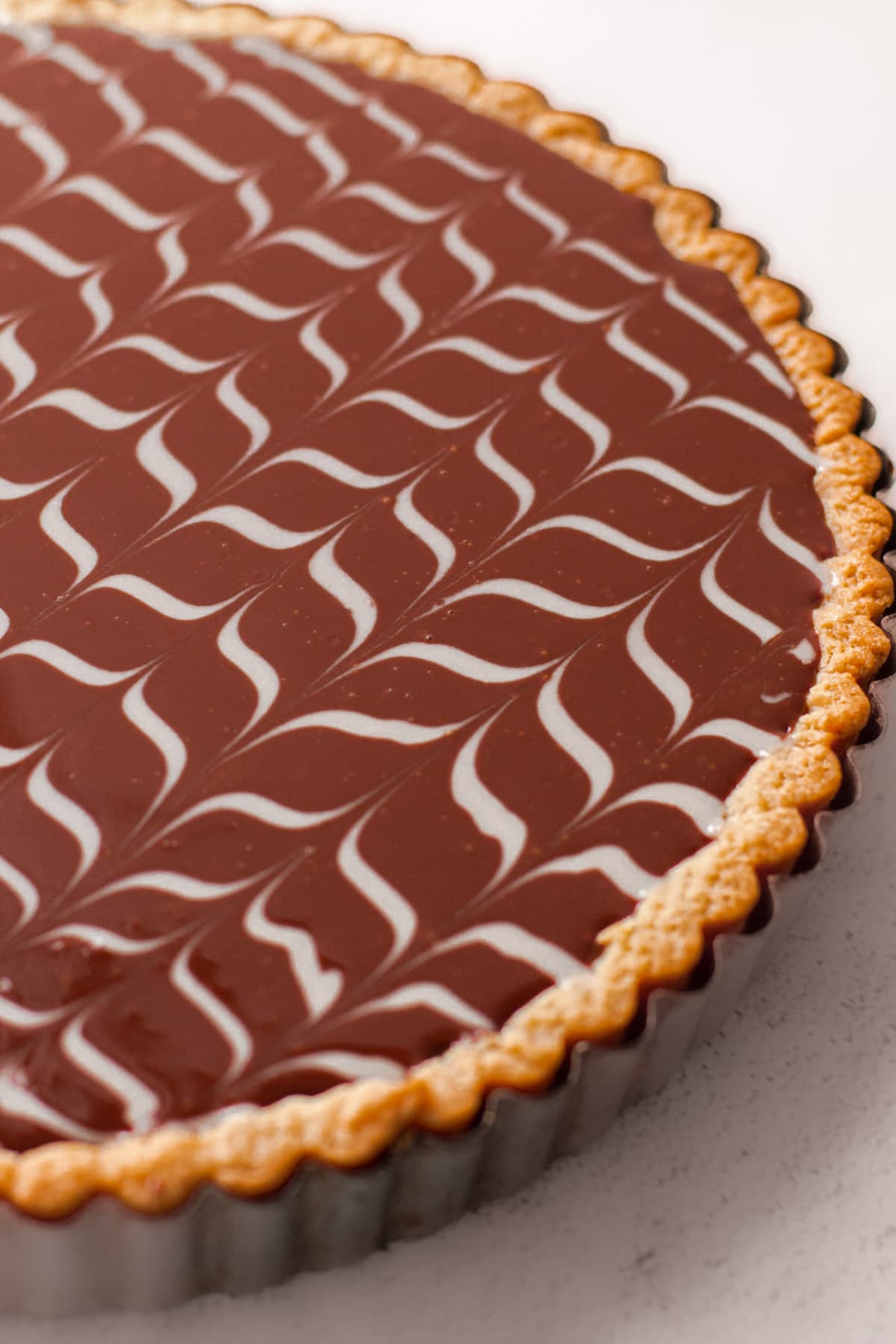 A tart filled with chocolate ganache.