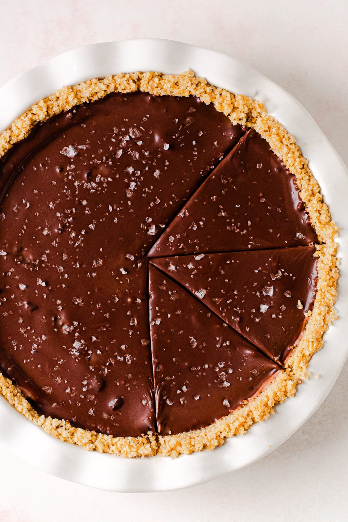 A crumb-crust pie filled with chocolate ganache.