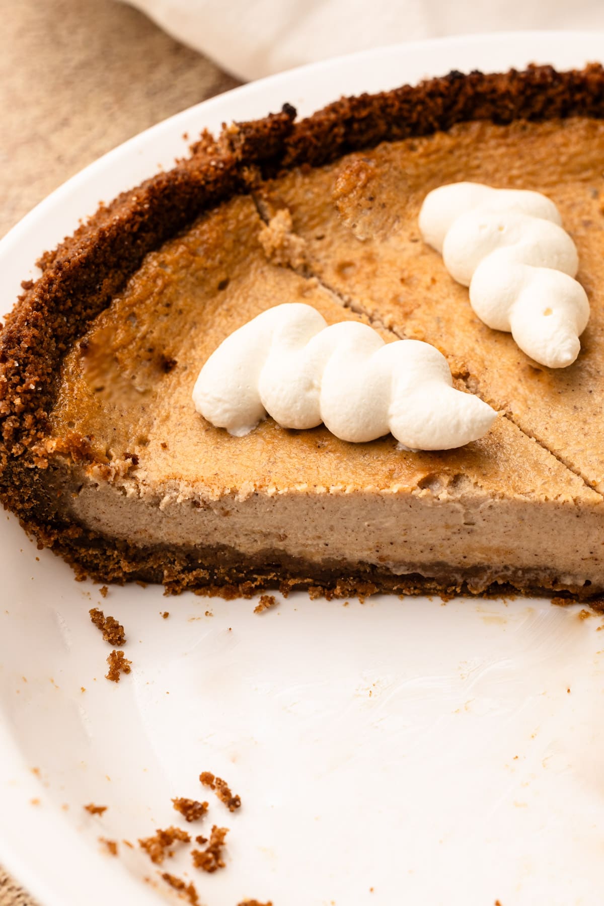 A slice of baked Cinnamon Pie in a pie dish.