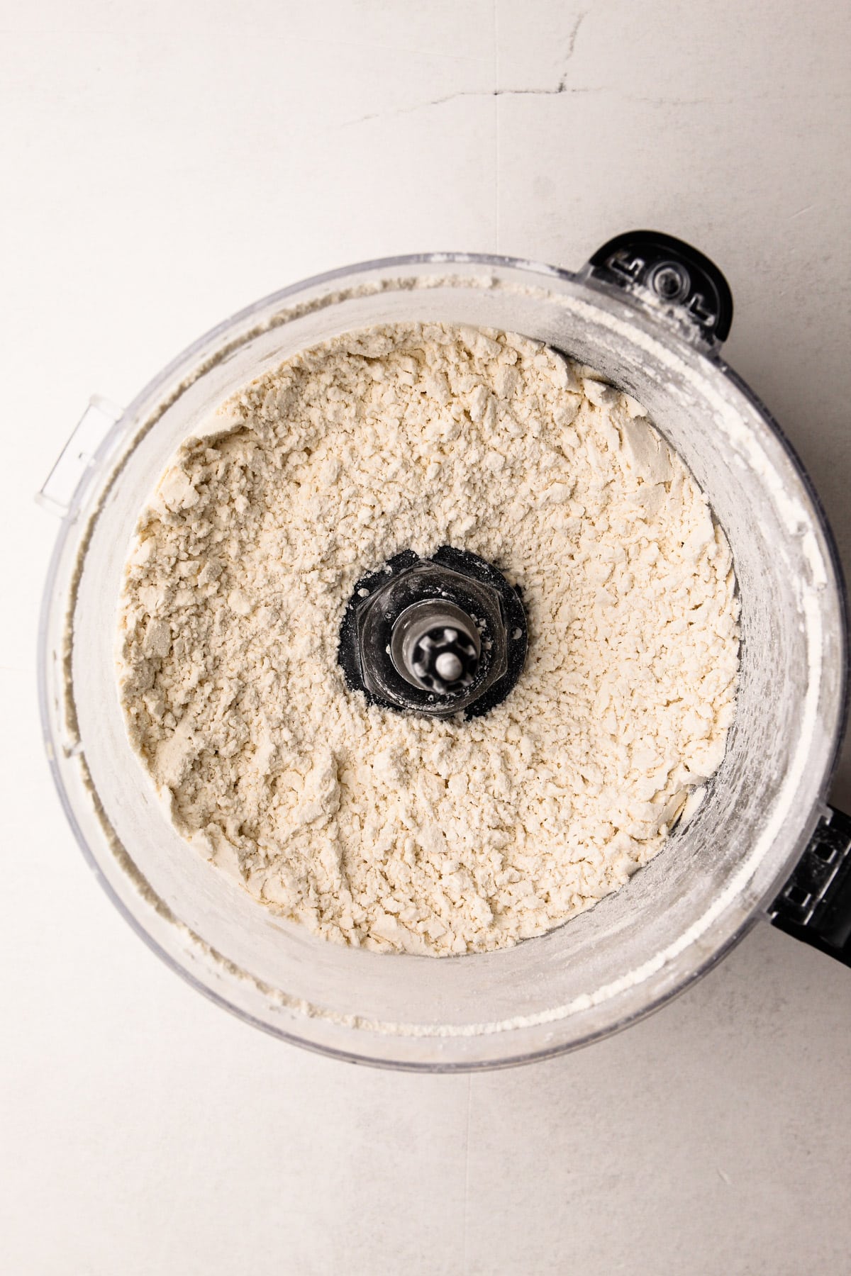 Processed flour and cream cheese in a food processor.