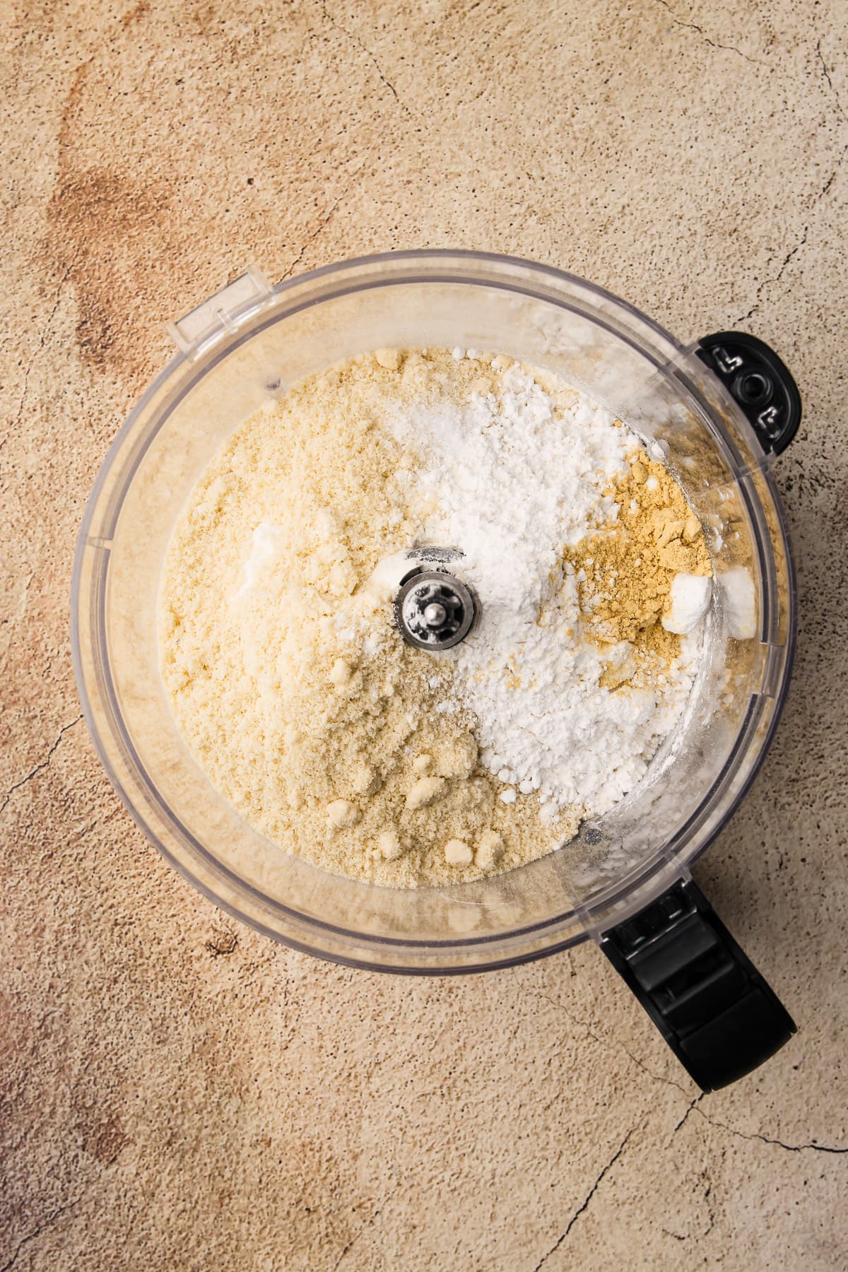 Crust ingredients for Honeynut Squash Tart in a food processor.