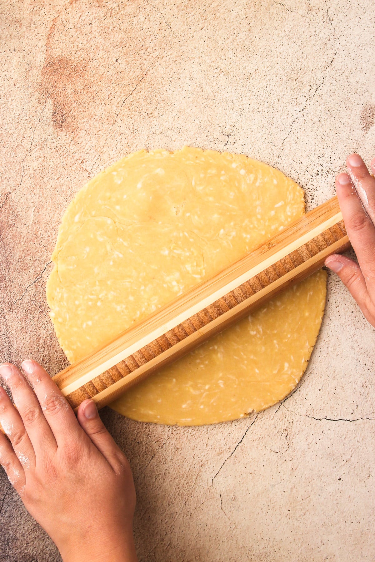 Rolling out pastry for a tart.