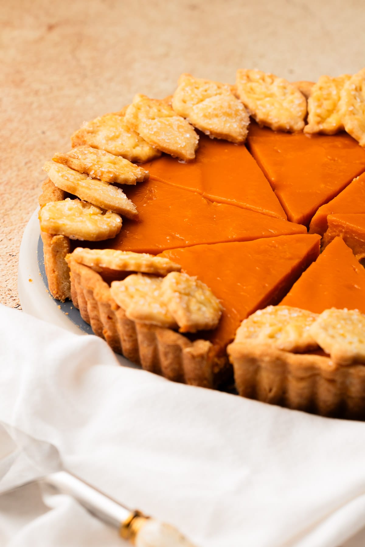 A baked Honeynut Squash Tart, cut into slices.