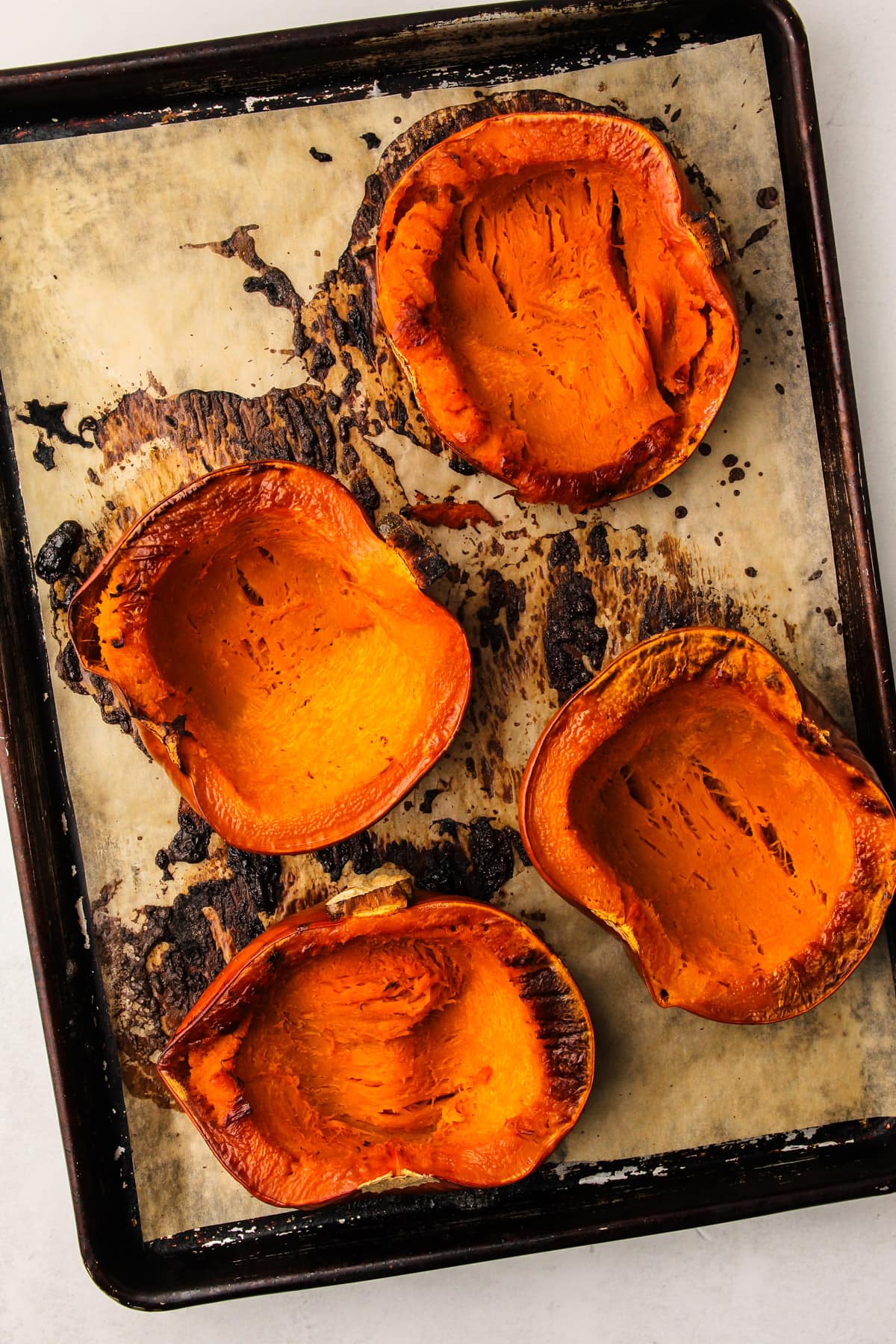 Roasted pumpkin on a sheetpan.