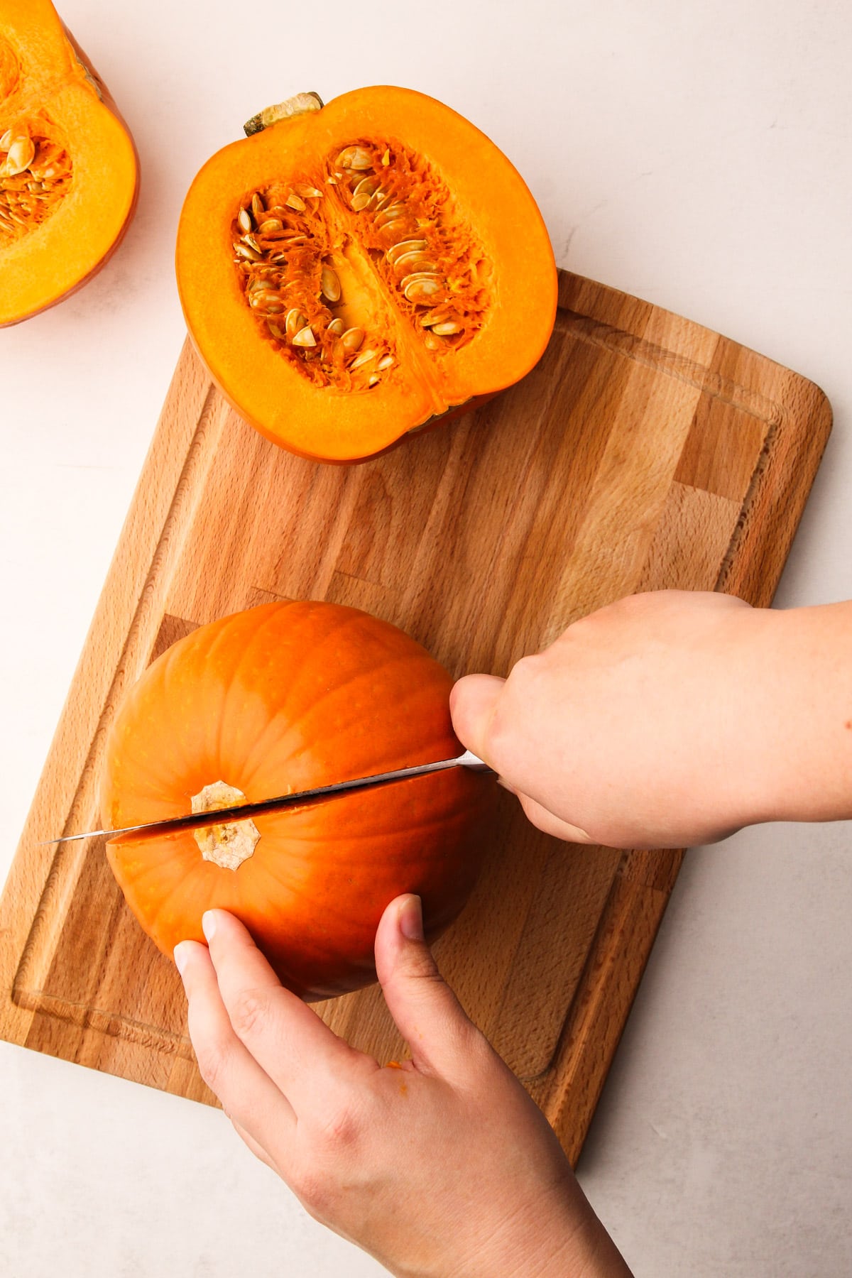 Cutting open a sugar pumpkin.