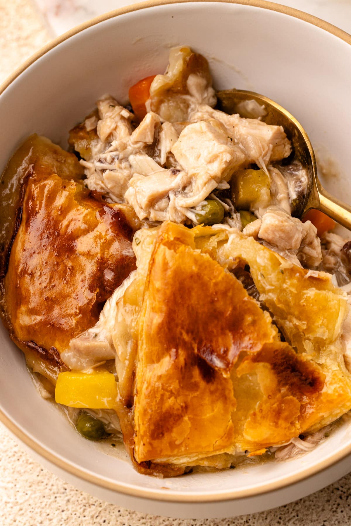 A serving of turkey pot pie in a white bowl.