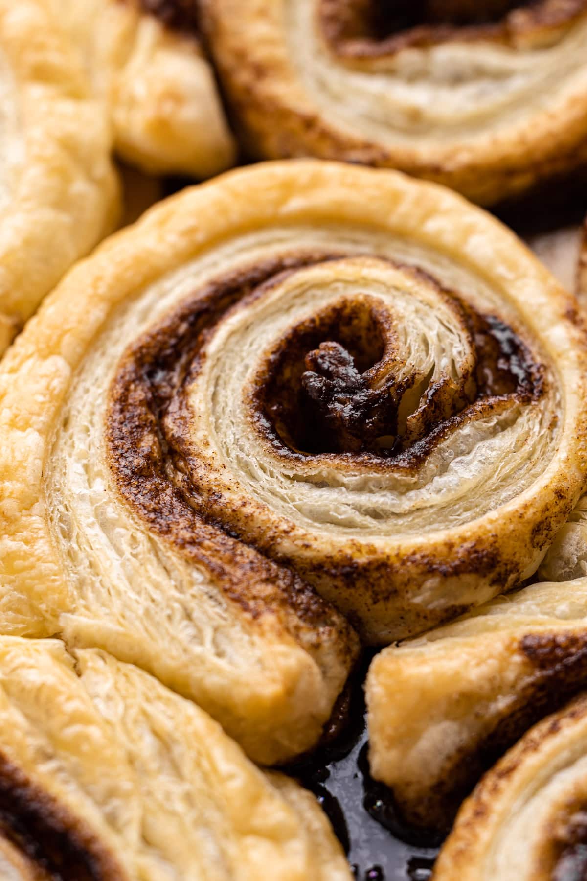 A baked puff pastry cinnamon roll.