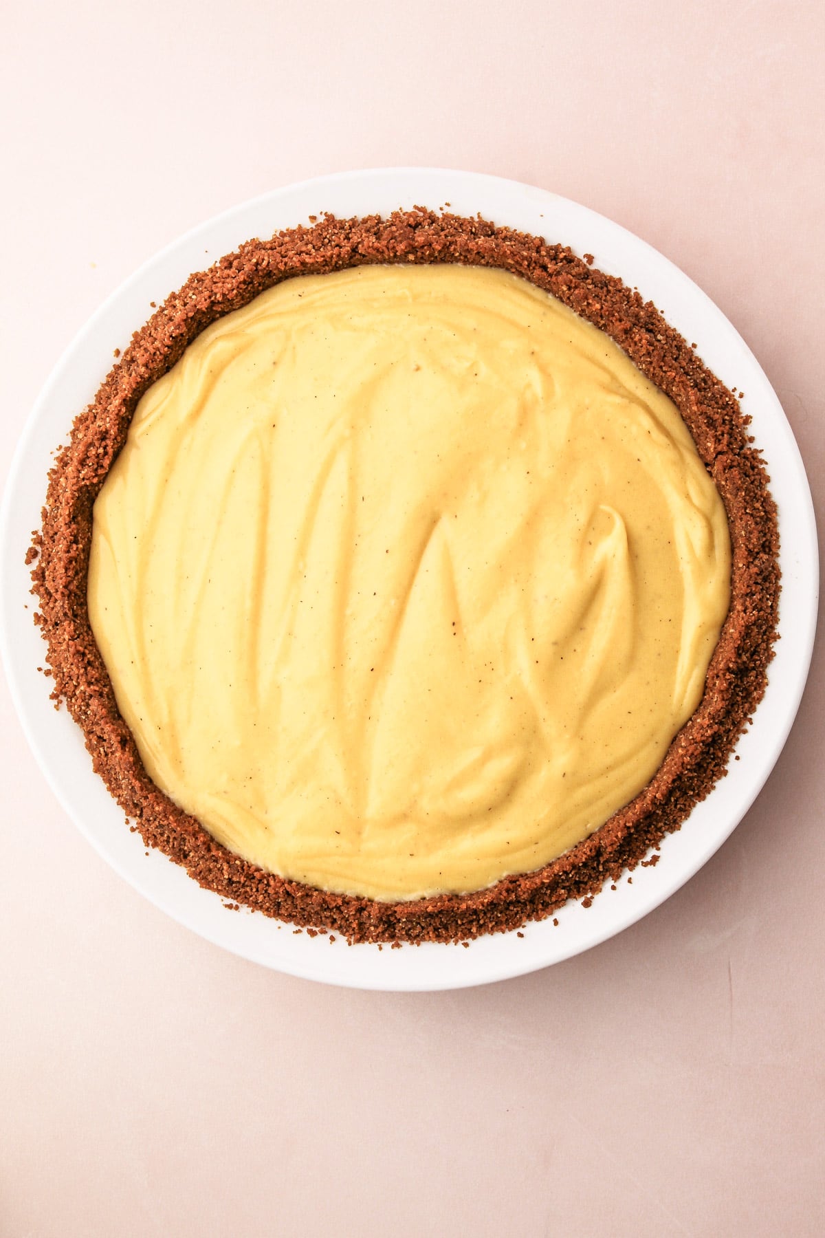 A crumb crust pie shell filled with eggnog cream pie filling.