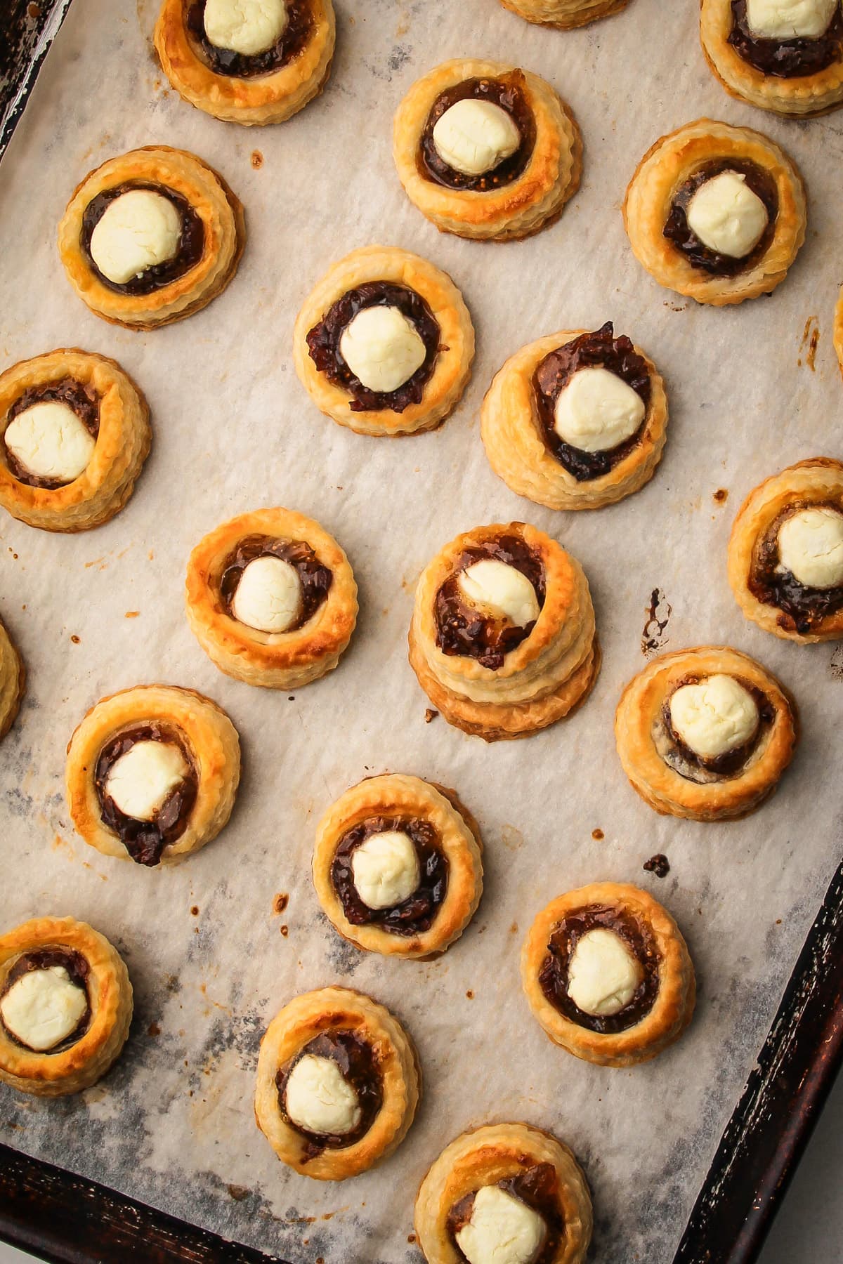 Baked goat cheese and fig puff pastry tarts.