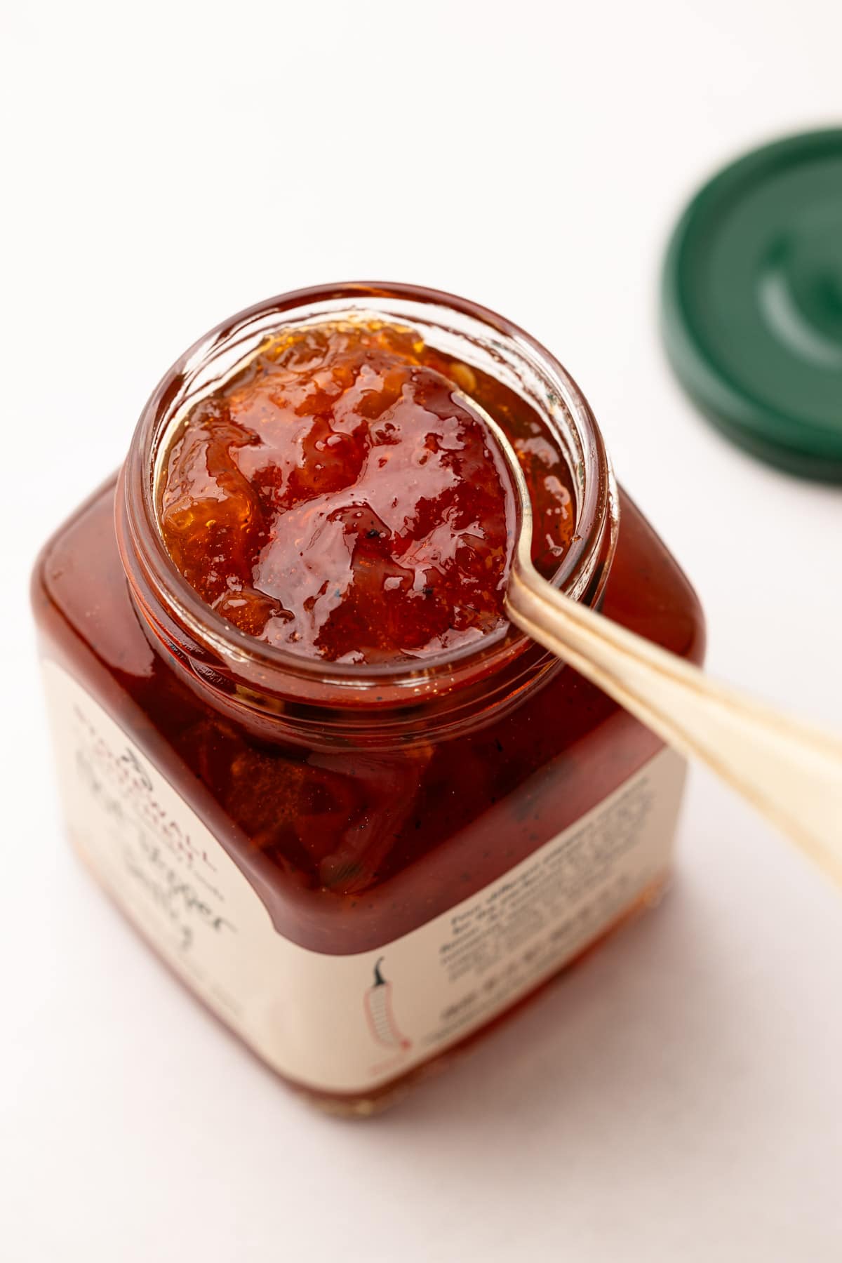 A jar of hot pepper jelly for cream cheese and pepper jelly bites.