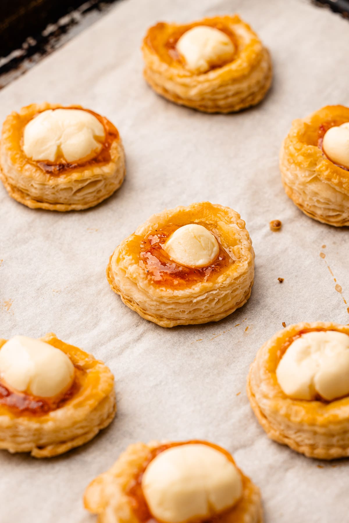 Baked cream cheese and pepper jelly bites on a baking sheet.