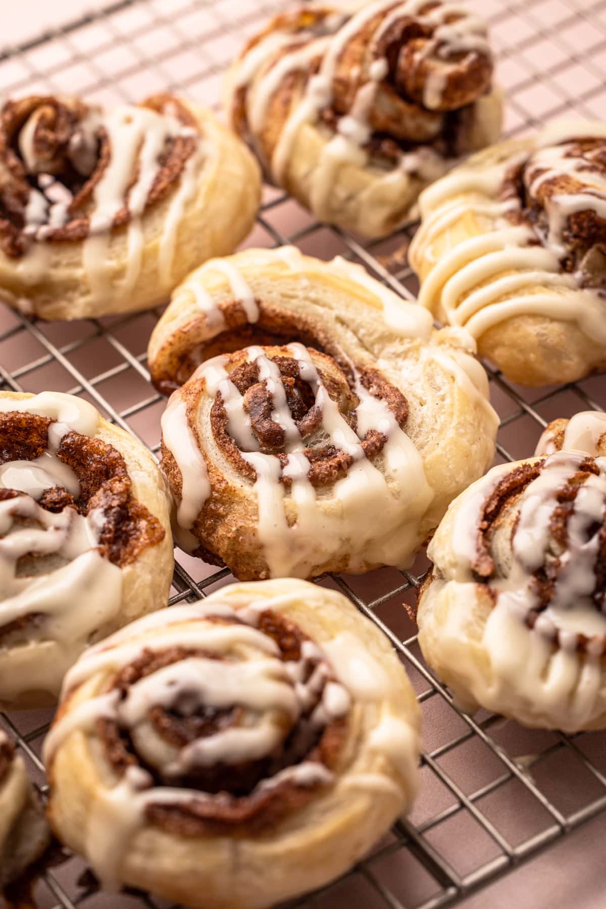 Baked and glazed puff pastry cinnamon rolls.