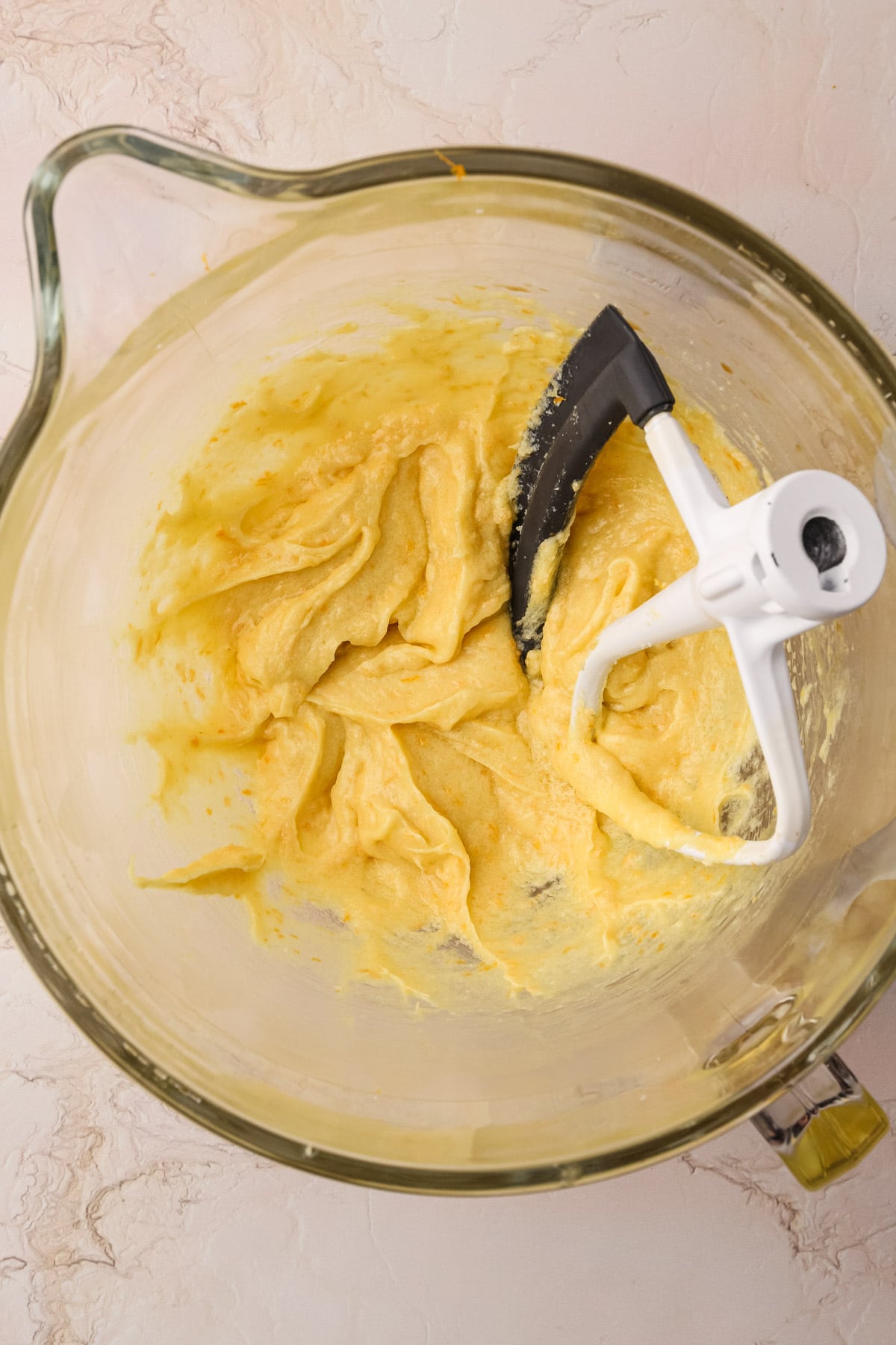 Creamed butter, olive oil and sugar in a mixing bowl.