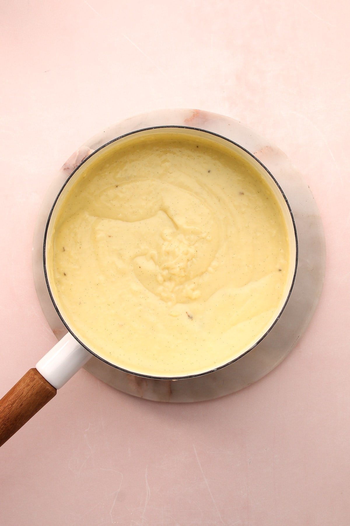 Cooked custard for homemade vanilla pudding in a saucepan.