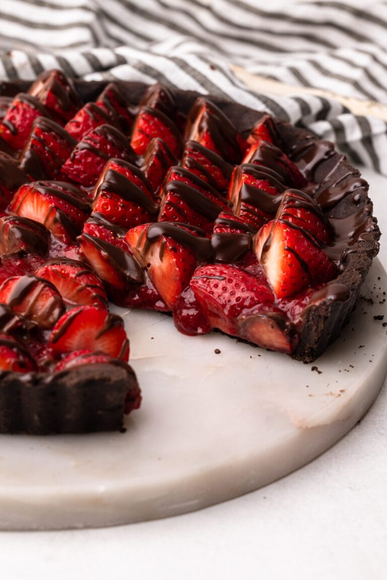 A chocolate strawberry pie drizzled with melted chocolate.