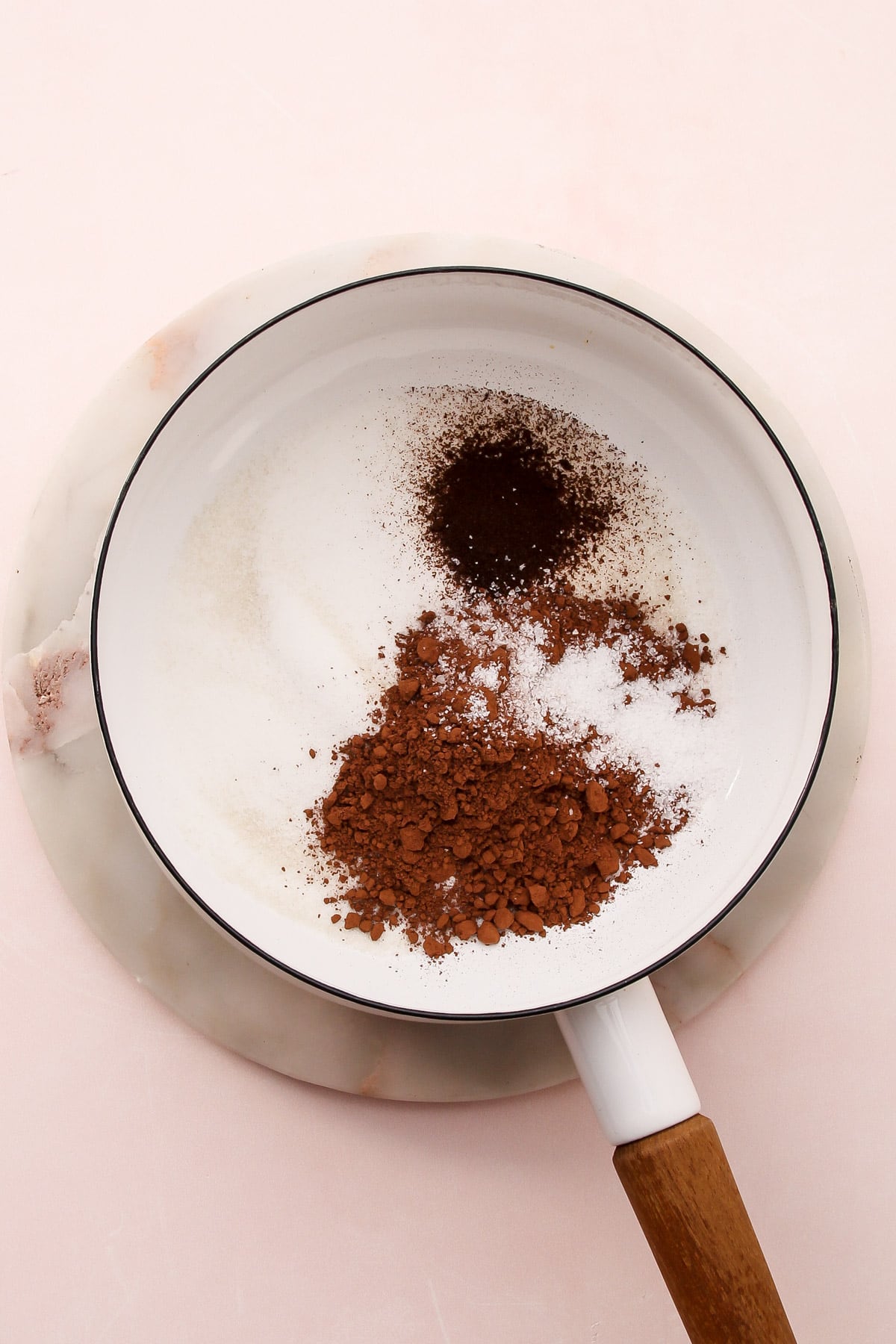 Dry ingredients for dark chocolate pudding in a saucepan.