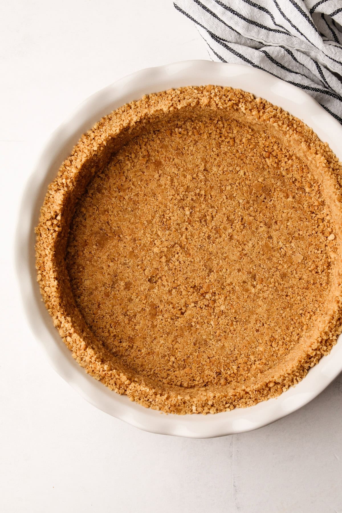 A crumb crust in a pie dish.