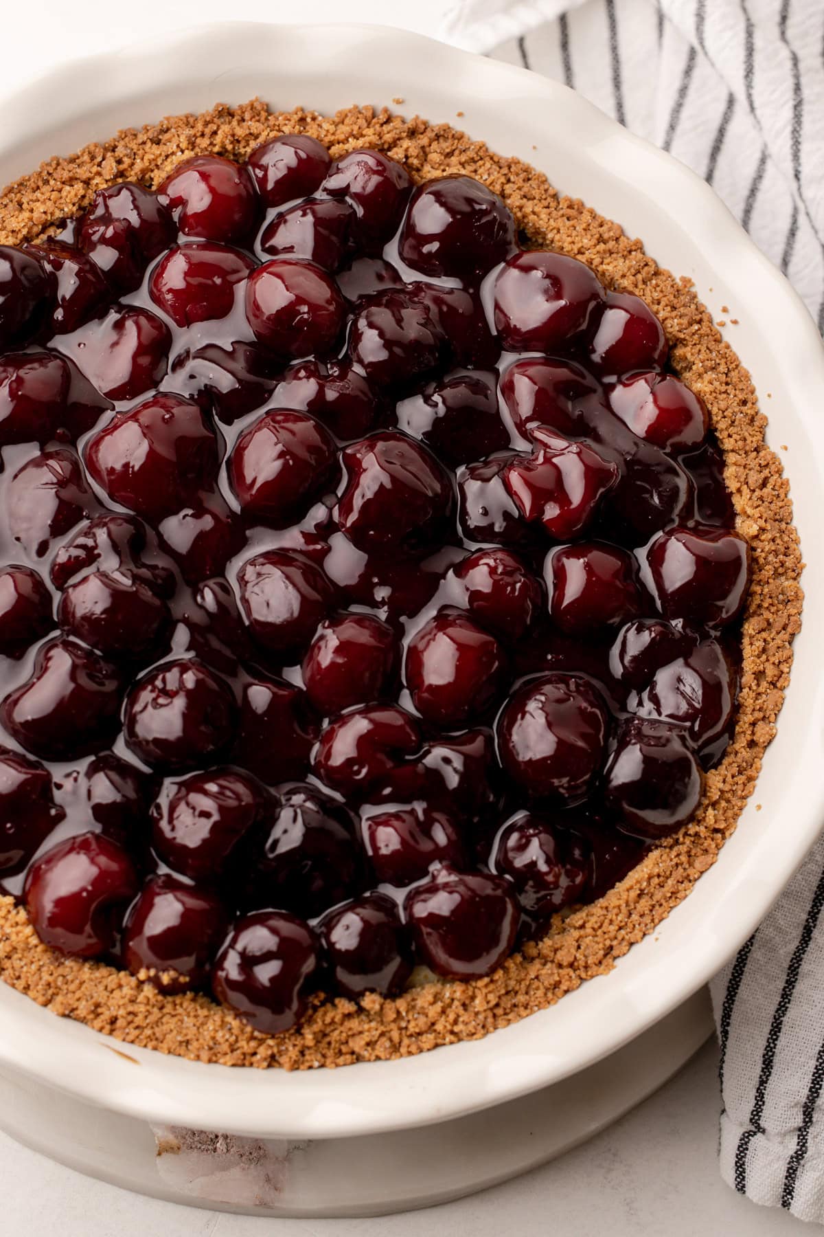 A baked cherry cheesecake pie.