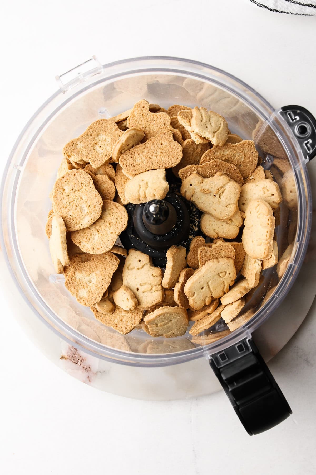 Animal crackers in a food processor.