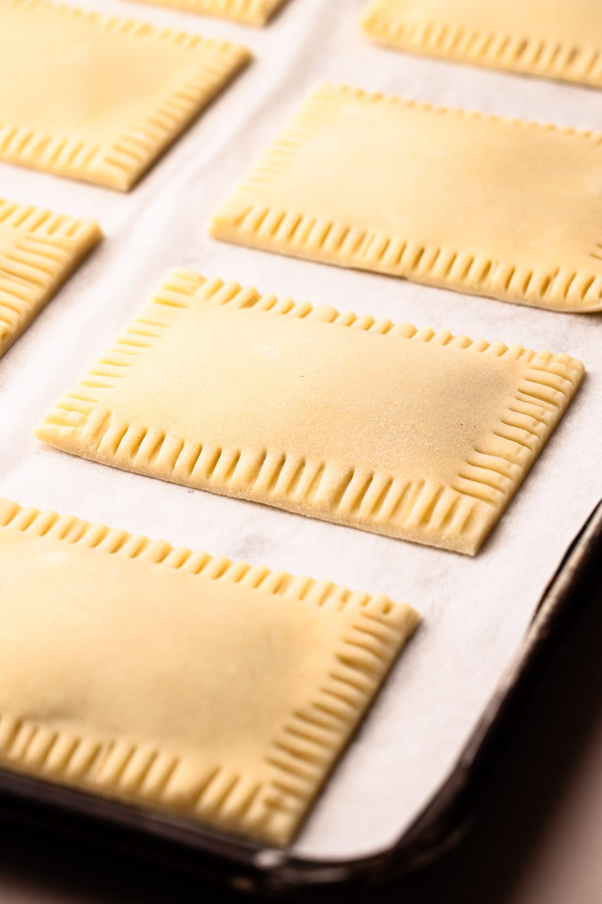 Unbaked but assembled berry pop tarts.