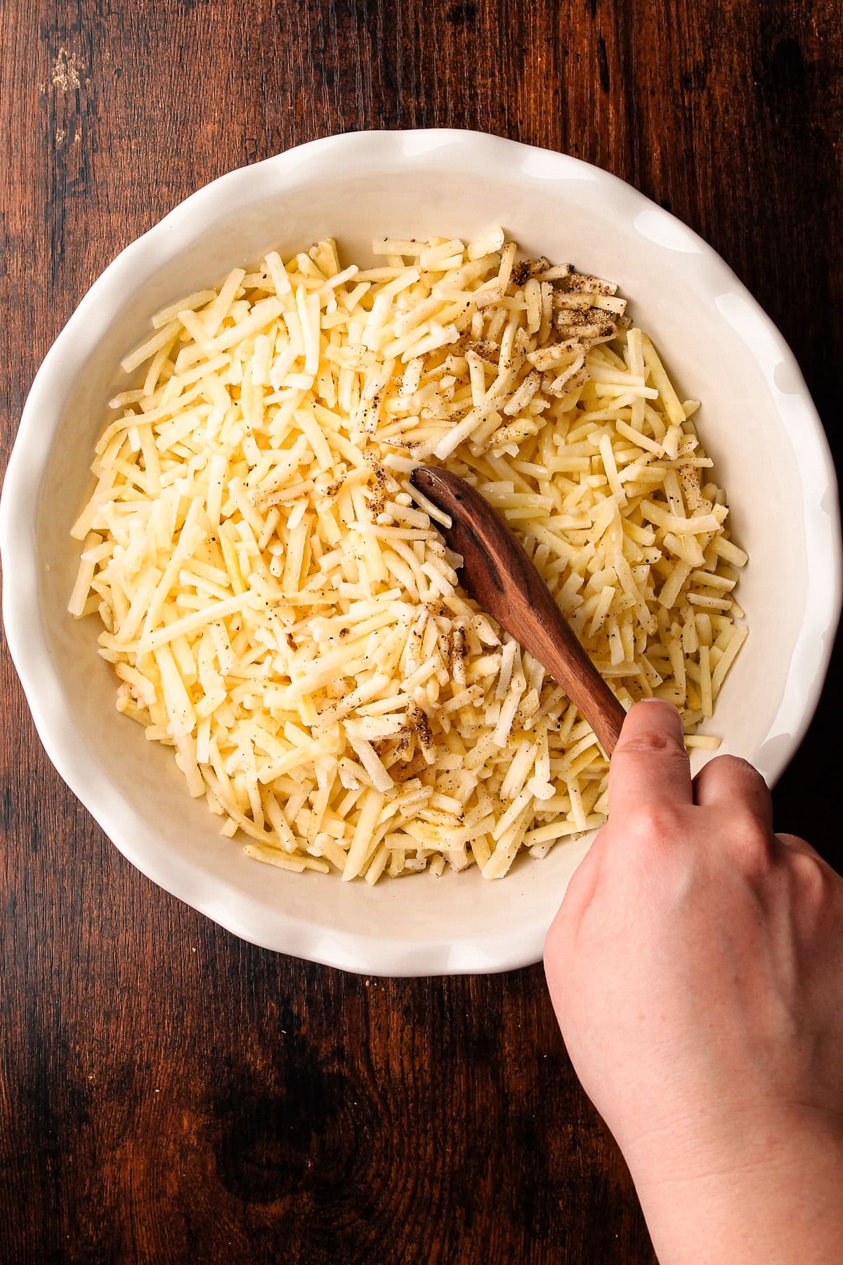 Stirring together the ingredients for a pie crust made from frozen potatoes.