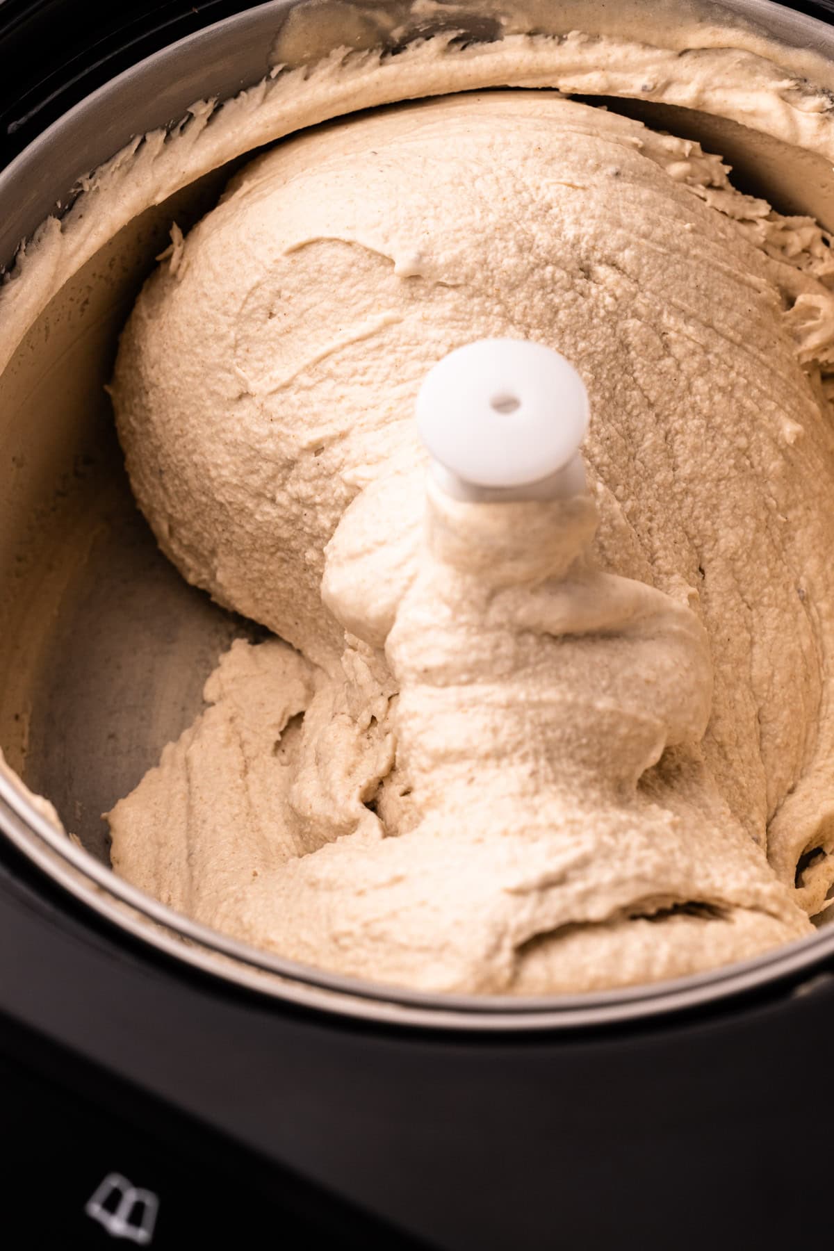 Banana ice cream inside of an ice cream spinner.