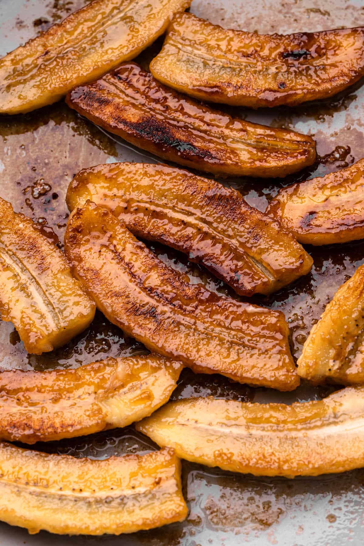 Caramelized bananas in a skillet.