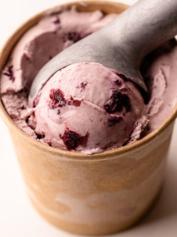 A scoop of homemade cherry ice cream.