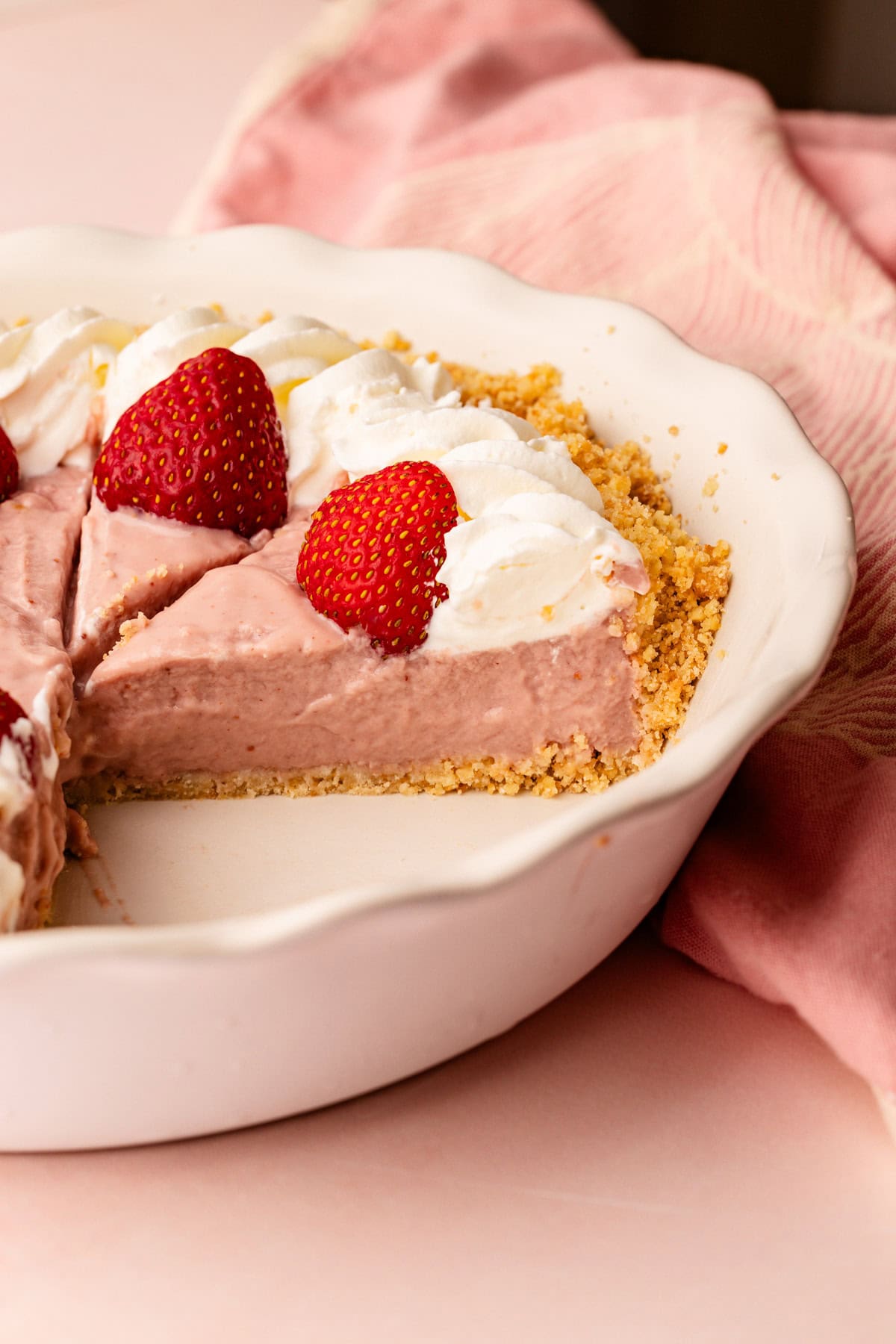 Strawberry pudding inside of a crumb crust to make a strawberry pudding pie.