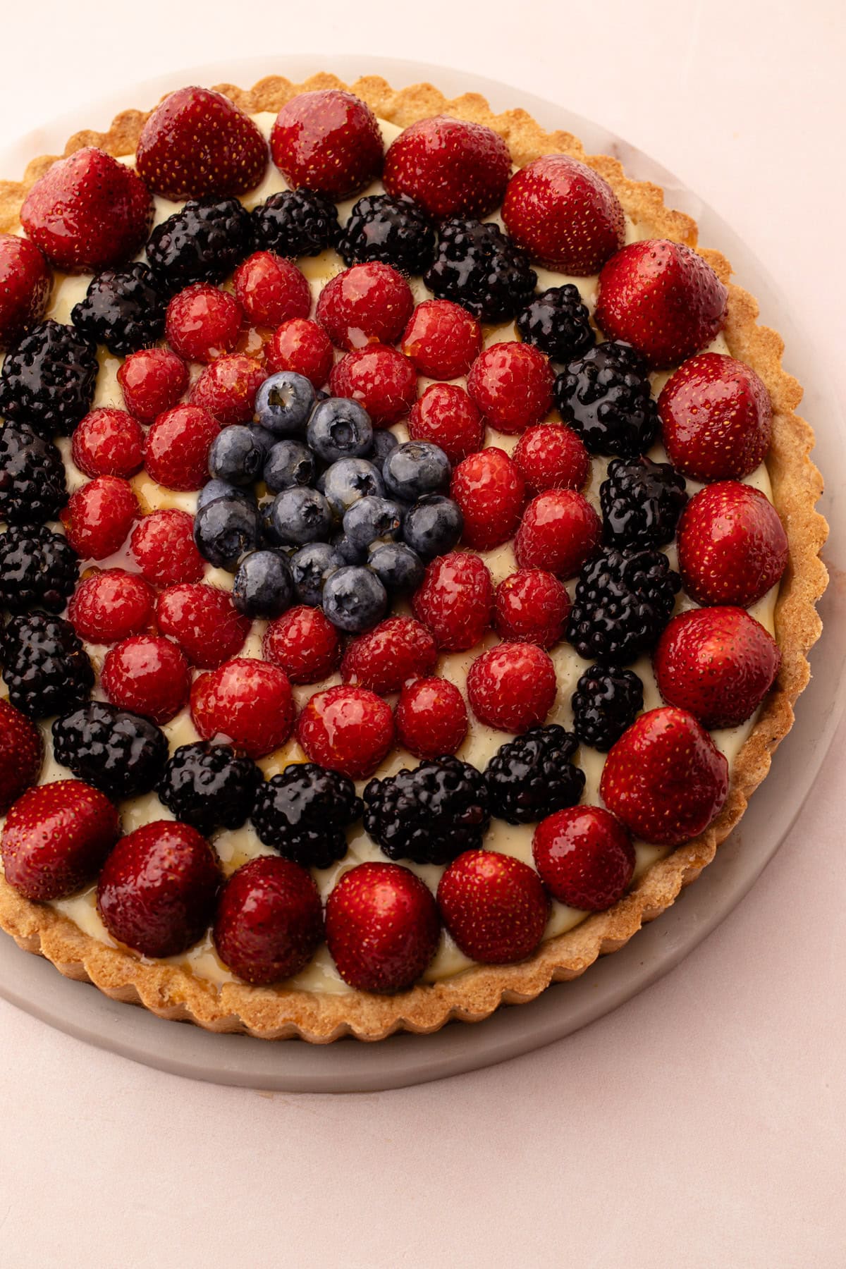 Classic fresh fruit tart with a variety of berries on top