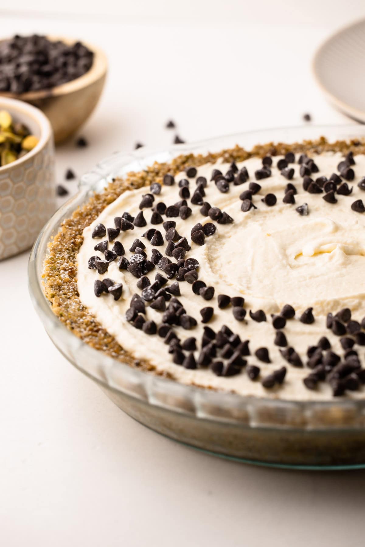 Fully prepared cannoli pie with a swirl of filling and chocolate chip topping.