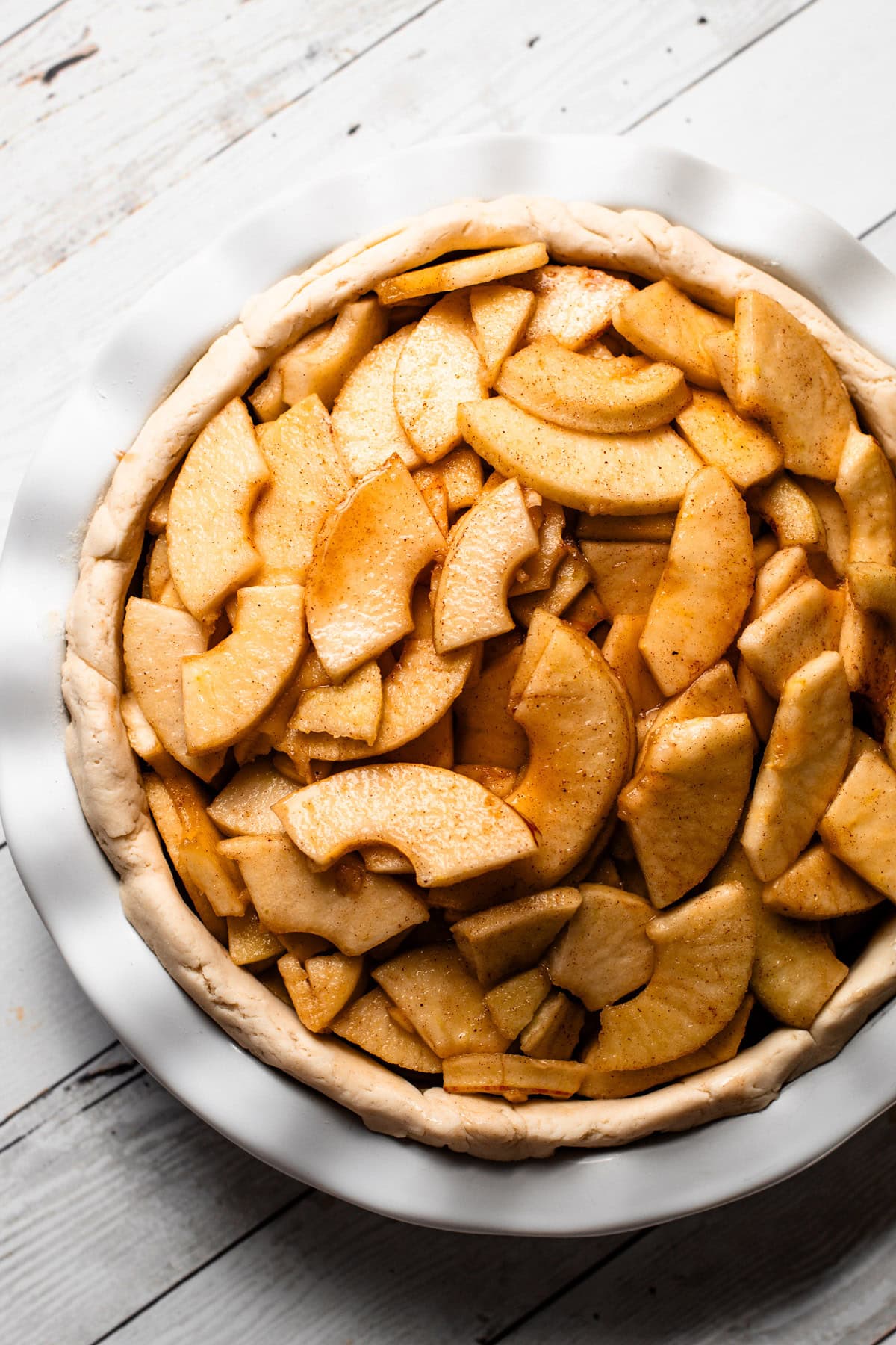 A gluten free apple pie assembled but unbaked.