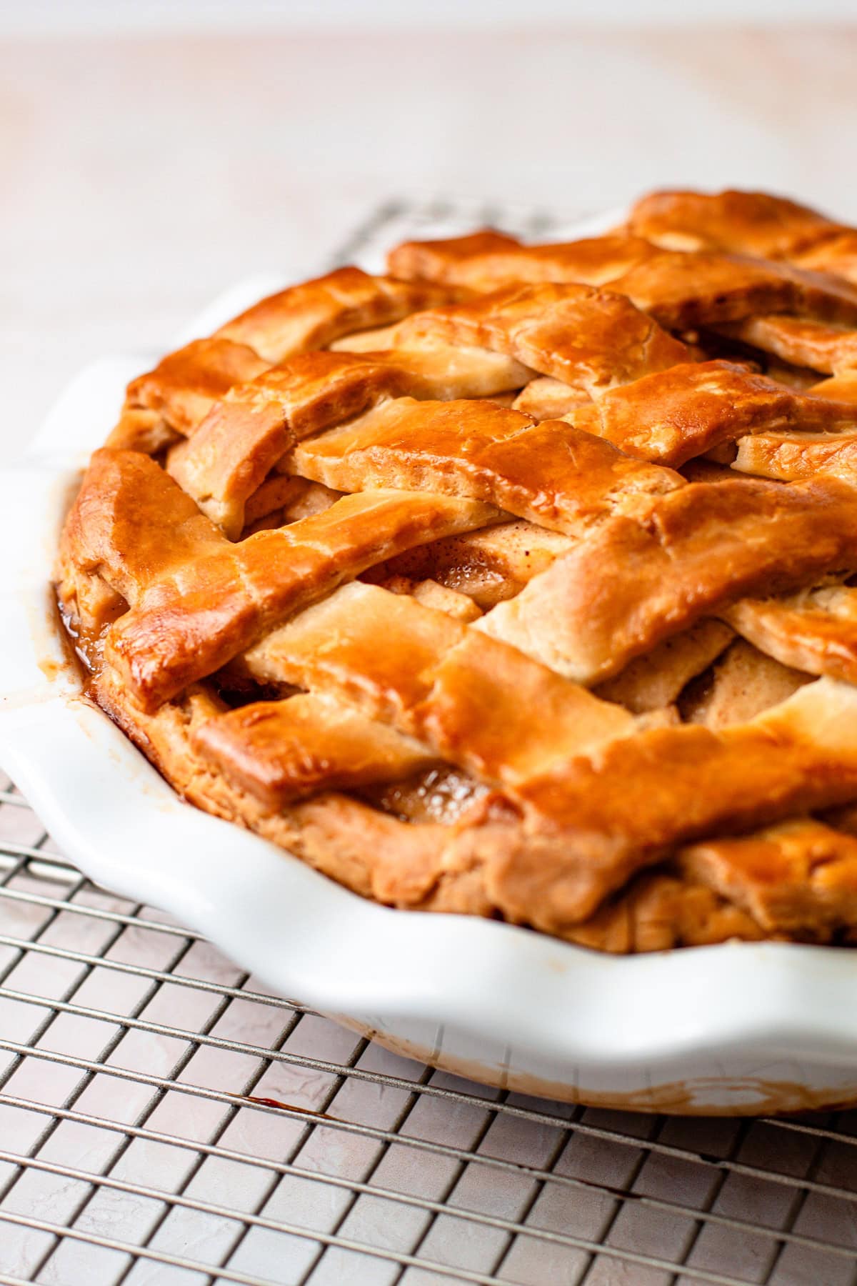 A fully baked gluten free apple pie with a lattice.