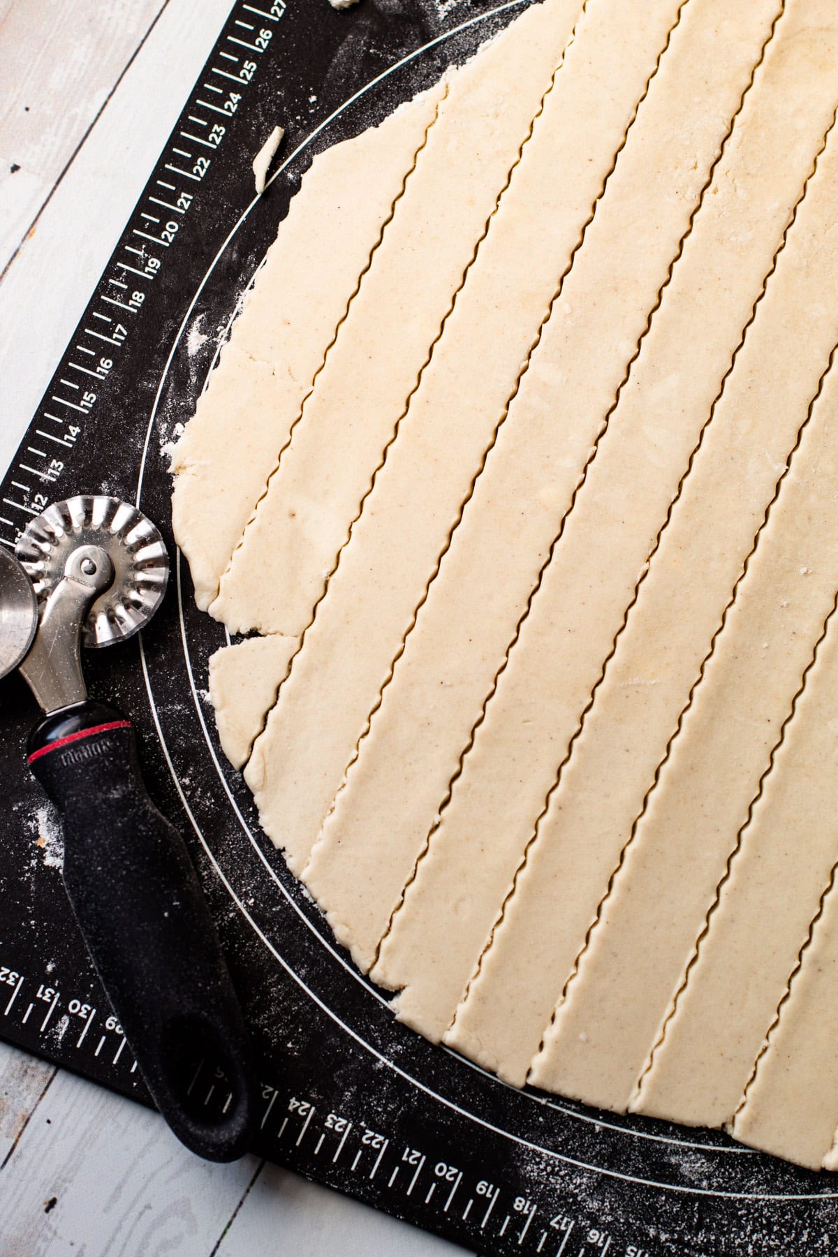 A gluten free pie dough cut into strips for a lattice.