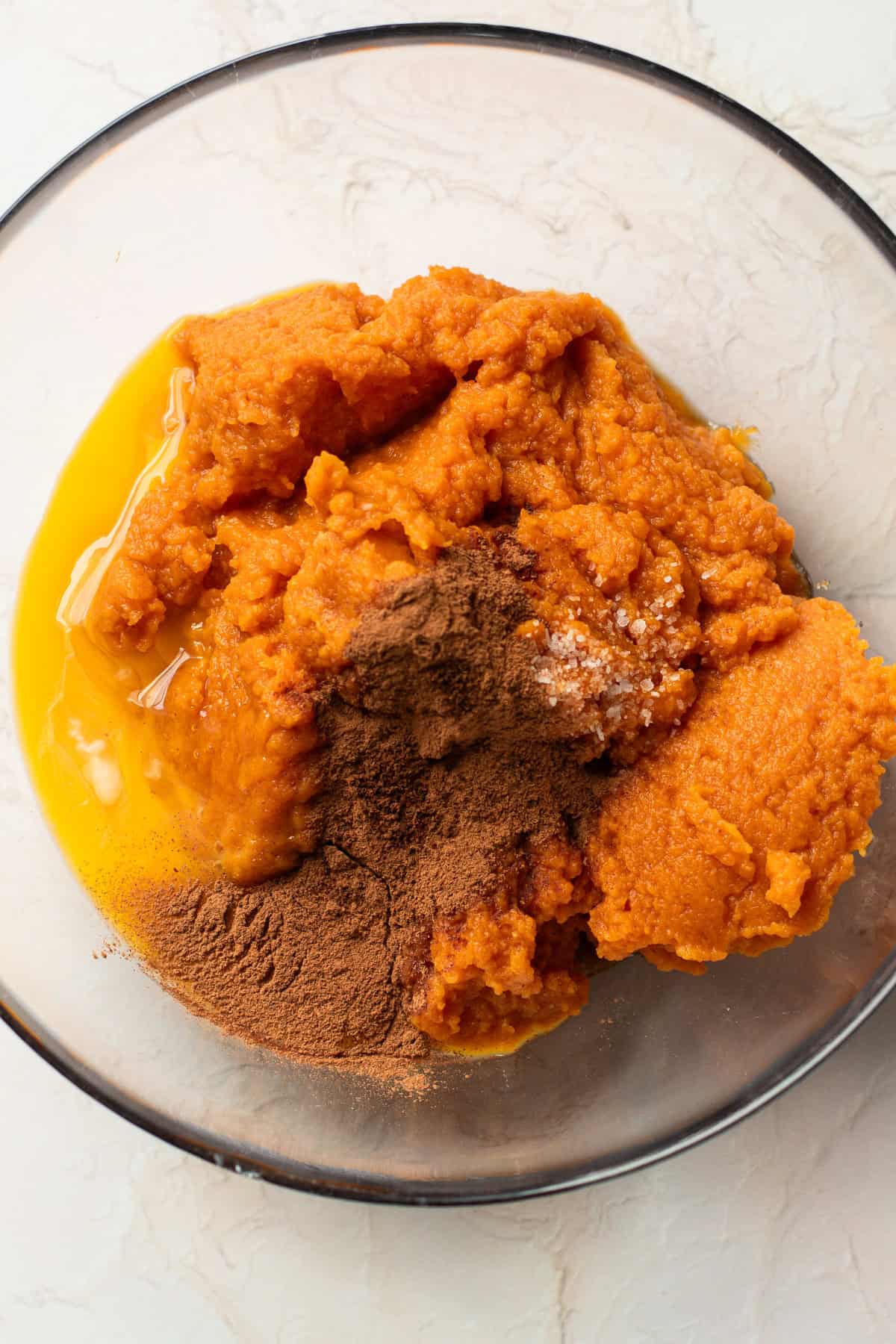 Pumpkin filling with cinnamon and spices in a glass bowl for pumpkin pasties.