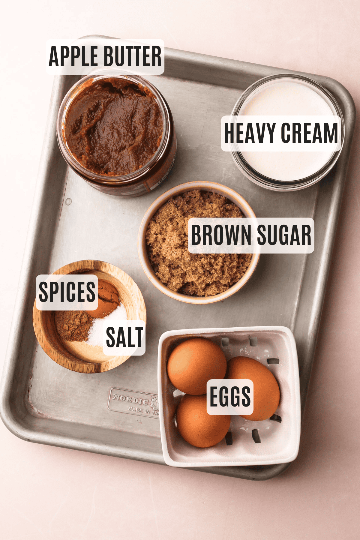 A labeled tray of ingredients for making a recipe for apple butter pie, featuring apple butter, heavy cream, and brown sugar.