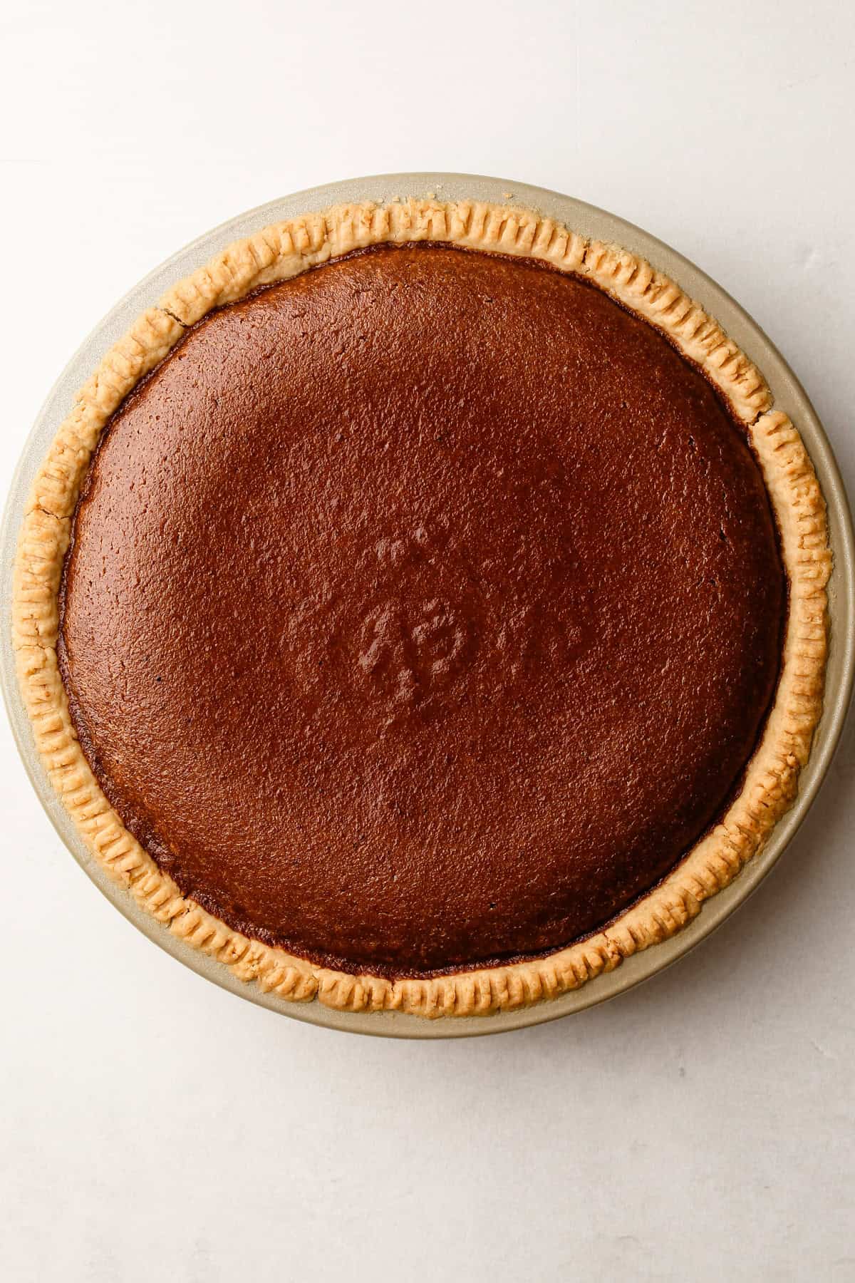 A melted butter pie crust with a baked filling.