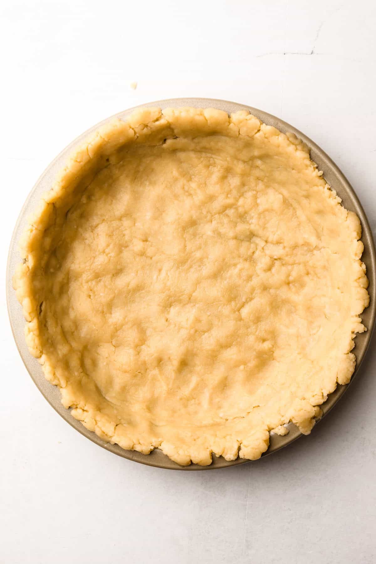 A pie crust made from melted butter pressed into a tin.