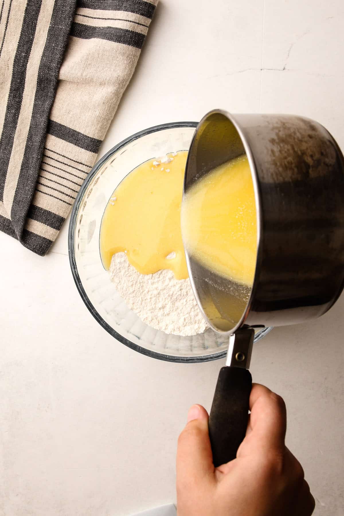 Pour melted butter into flour for an easy press-in butter pie crust.