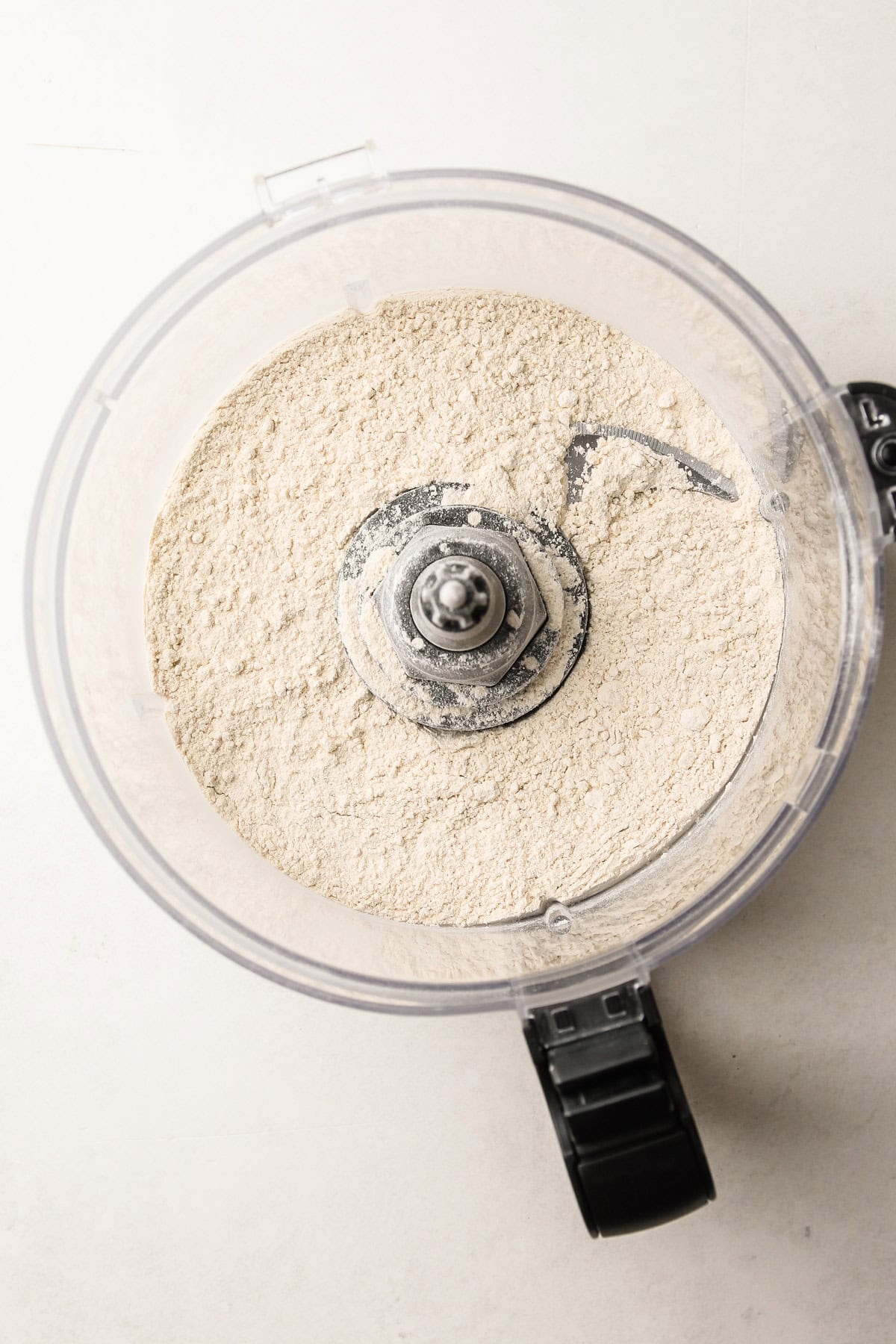 Whole wheat flour in a food processor for pie crust made.