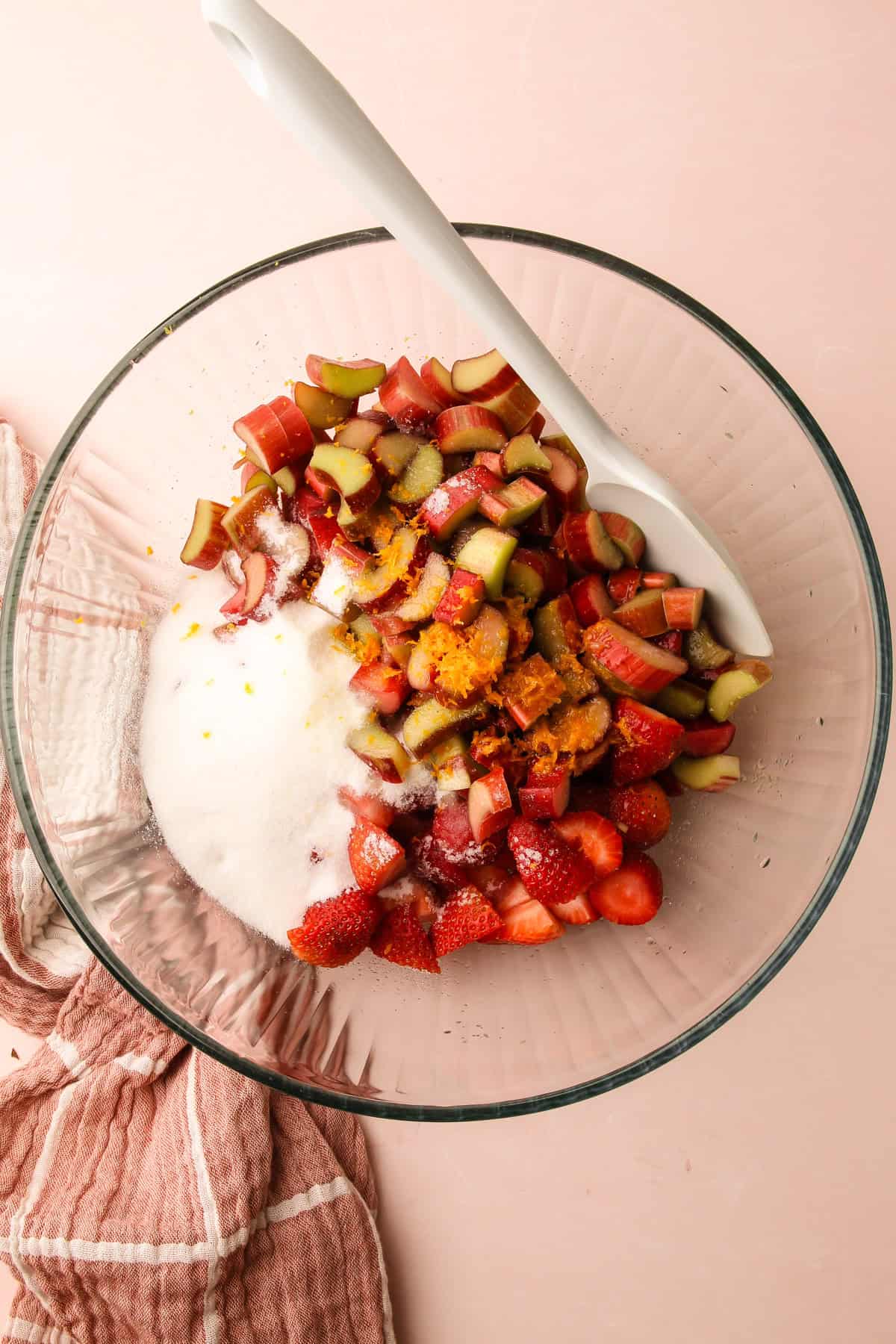 Strawberry rhubarb pie filling ingredients in a bowl.