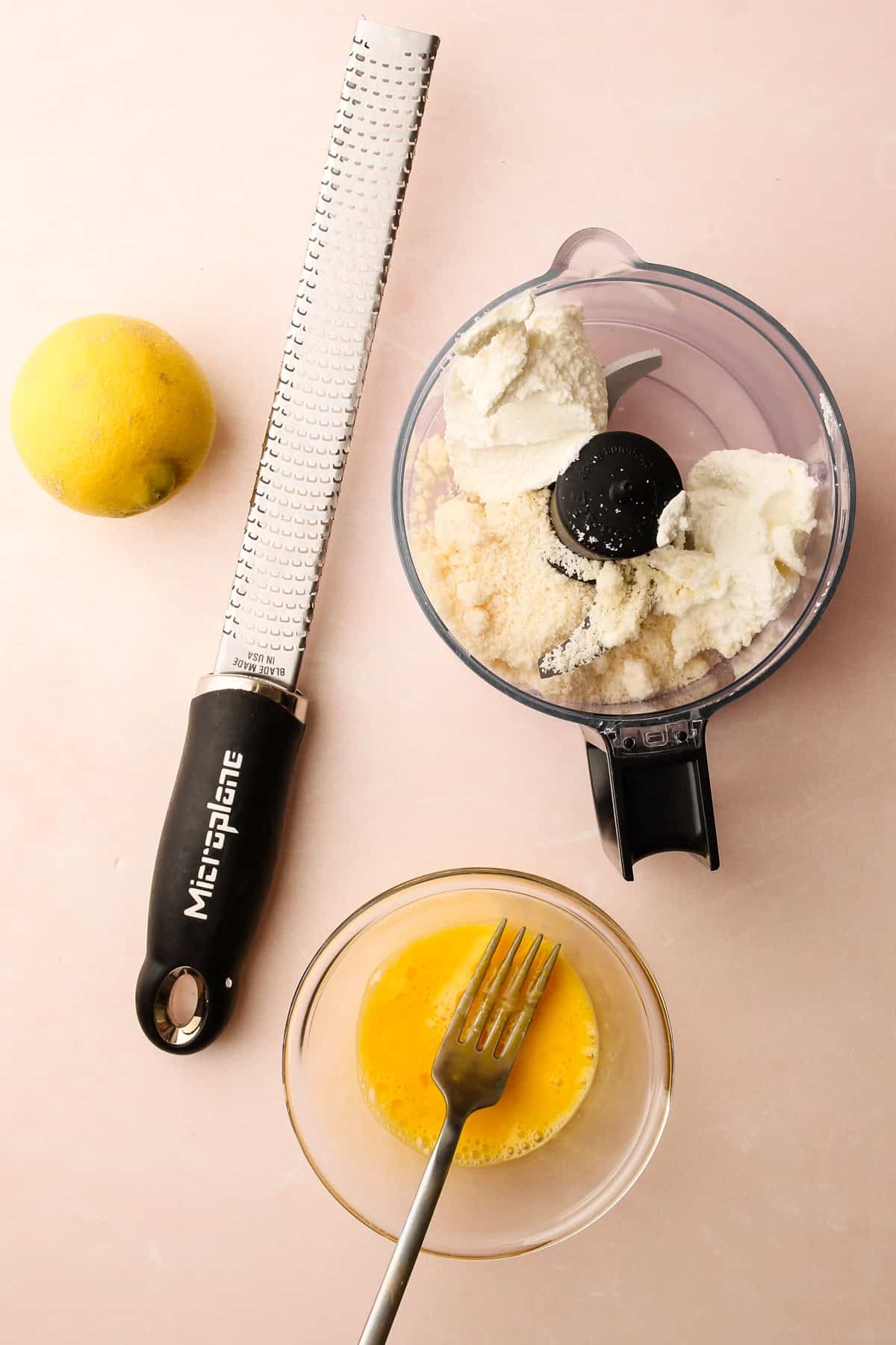 Tools and ingredients for making ricotta asparagus tart filling.