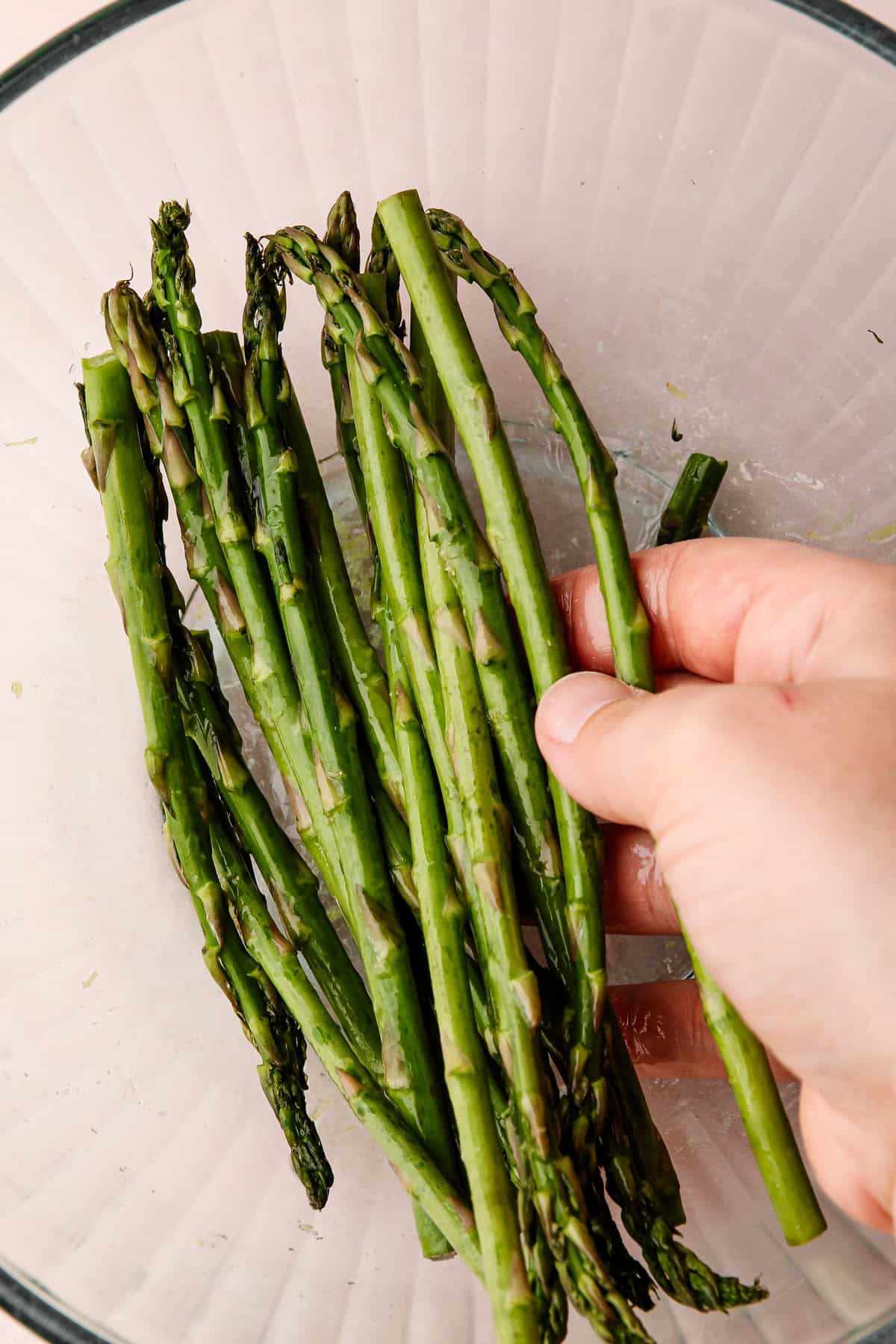 A bowl of prepared asparagus for an asparagus tart.