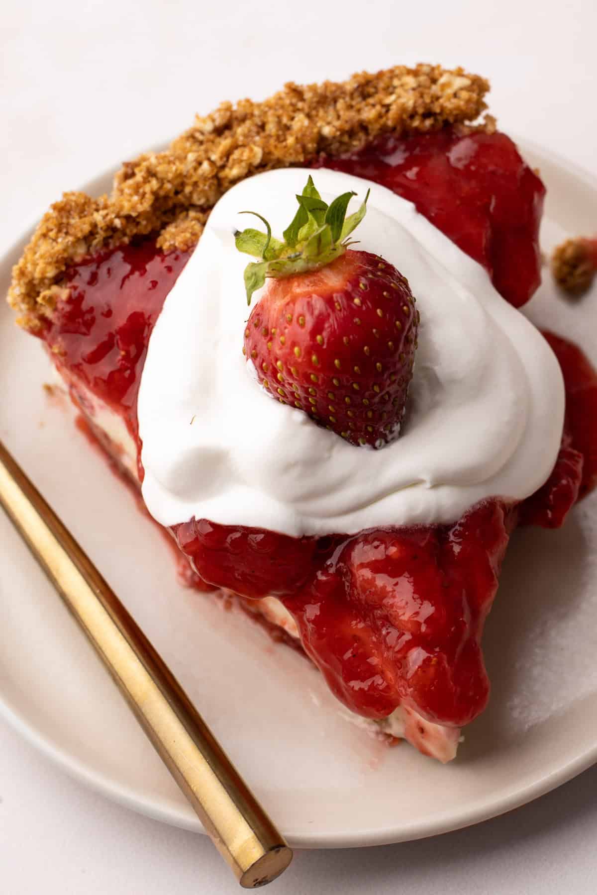 Stabilized whipped cream on top of a strawberry pie.